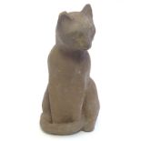 A terracotta model of a seated cat. Signed to base. Approx. 9 1/4" high. Please Note - we do not