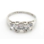 A platinum (950) ring set with three graduated cubic Zirconia. ring size approx R 1/2 Please