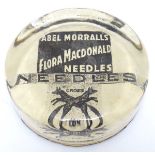 A 19thC monochrome paperweight advertising Abel Morrall's Flora MacDonald Needles with the Cross Fox