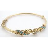 A 9ct gold bracelet set with turquoise and seed pearls. Please Note - we do not make reference to