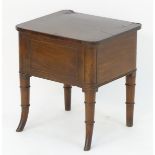 A mahogany Regency box stool with moulded decoration and standing on turned tapering legs. 17?