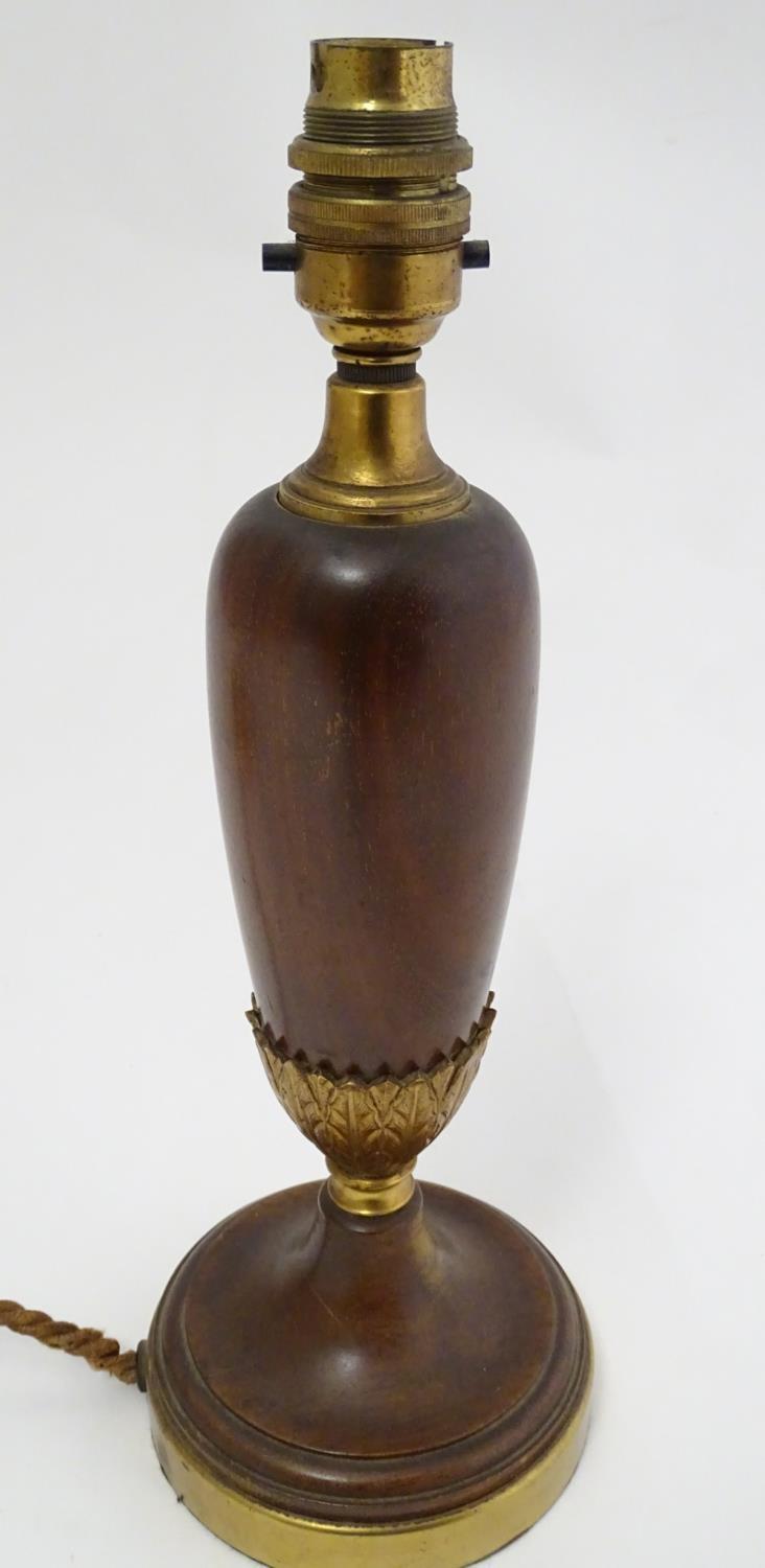 A wooden with brass detail pedestal table lamp, standing 12 1/2'' high. Please Note - we do not make