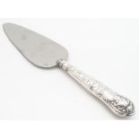 A silver handled pie / cake server. 10" long overall. Please Note - we do not make reference to