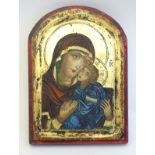 A Byzantine style carved wood Madonna and Child icon with polychrome and gold leaf decoration.
