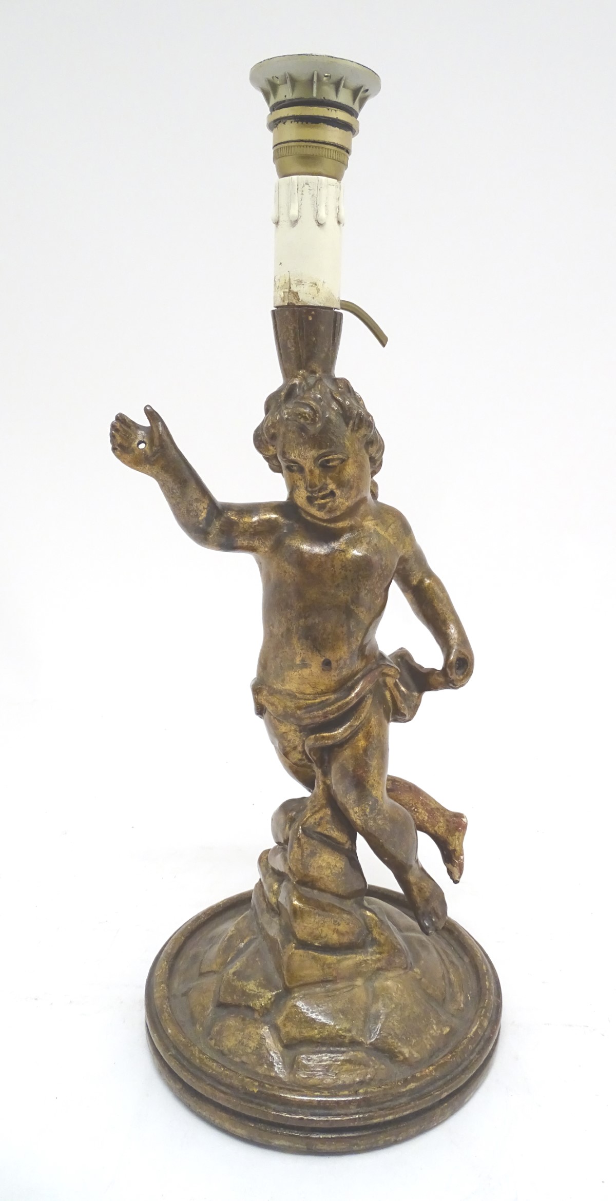 A composite lamp base formed as a classical putto / cherub on a rocky outcrop. Approx. 21" high