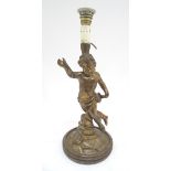 A composite lamp base formed as a classical putto / cherub on a rocky outcrop. Approx. 21" high