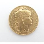 A French Republic 20 franc gold coin, 1907, approximately 6.5g Please Note - we do not make