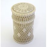 A carved bone cylindrical container / pot with banded reticulated decoration. Approx. 2 3/8" high.