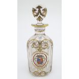 A 19thC glass decanter and stopper, decorated with hand painted marquess armorial and laurel with