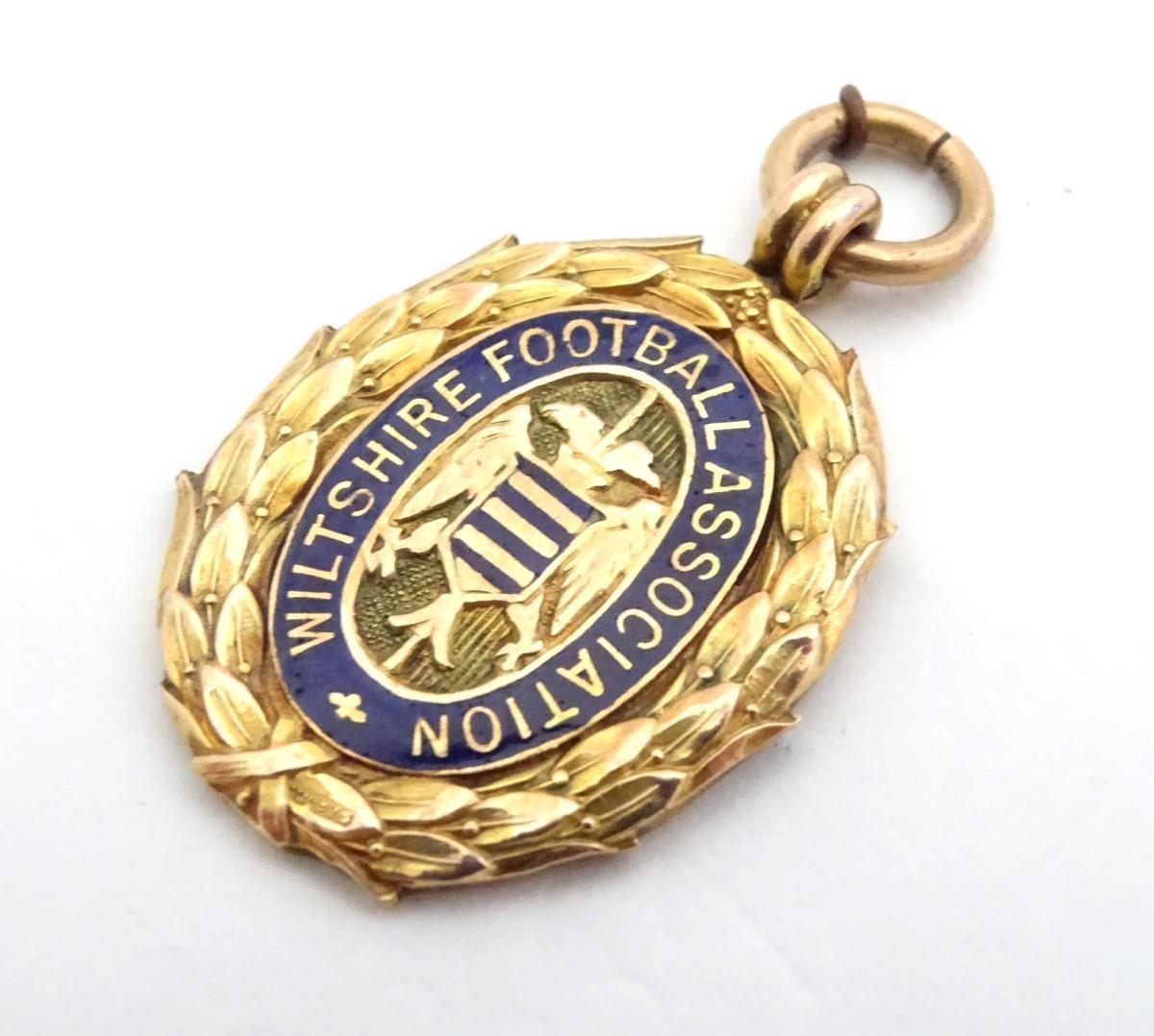 A 9ct gold fob medal with enamelled Wiltshire Football Association emblem. Total weight 8g Please - Image 4 of 13
