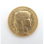 A French Republic 20 franc gold coin, 1908, approximately 6.5g Please Note - we do not make
