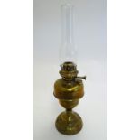 A Belgian c1930s Lempereur & Bernard oil lamp, the brass stand decorated with floral motifs and