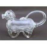 An early 20thC novelty glass claret jug / decanter in the form of a pig. approx 10 1/2" long