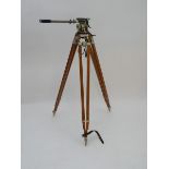 A 20thC tripod of wood construction with extending legs. Approx. 45" high (at current height) Please