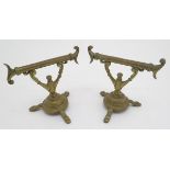A pair of late Victorian brass firetool rests/stands, each 7" tall, 8" wide Please Note - we do