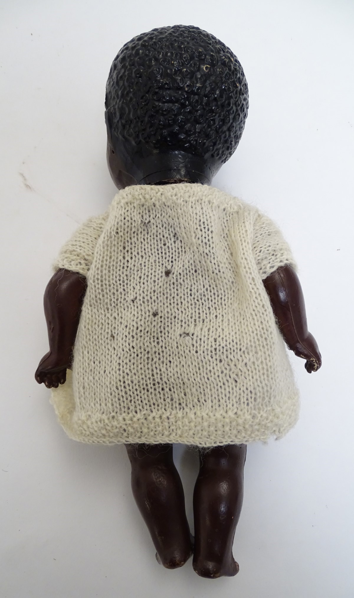 Toy: A black composite doll with articulated head, arms and legs, with modelled hair and painted - Image 6 of 7