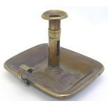 A brass chamberstick with banded decoration. Approx. 5 1/4" high. Please Note - we do not make