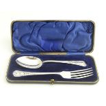 A christening set comprising a silver spoon and fork, hallmarked Sheffield 1902, maker Watson &