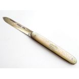 A silver folding fruit knife with mother of pearl handle, hallmarked Sheffield 1864, maker John