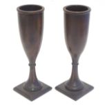Treen: A pair of walnut turned fluted vases on squared bases. Approx. 7 7/8" high (2) Please