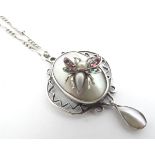 A silver pendant and chain, the pendant set with pearl blister decorated with insect decoration .