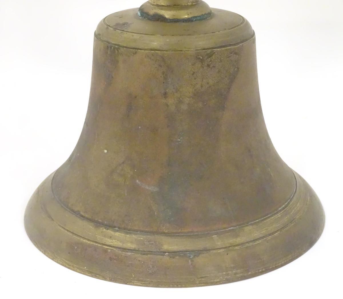 A 19th / 20thC large hand bell with a turned wooden handle and incised banded decoration. Approx. 14 - Bild 6 aus 8