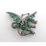 A silver brooch formed as a dragon with green guilloche enamel, marcasite and red stone decoration 1