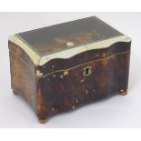 A 19thC tortoiseshell and faux tortoiseshell box / caddy of shaped form with a hinged glass topped