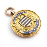A 9ct gold fob medal with enamelled Wiltshire Football Association emblem. Total weight 14g Please