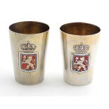 Scandinavian silver : A pair of Norwegian silver gilt tot cups with enamel coat of arms and engraved