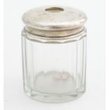 A glass dressing table jar with silver hair tidy top hallmarked London 1921 maker Collett & Anderson