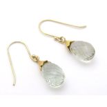 A pair of gilt metal drop earrings set with facet cut drops 1 1/2" long Please Note - we do not make