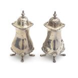 A pair of silver pepperettes hallmarked Sheffield 1914/15 maker Walker & Hall 3 3/4" high Please
