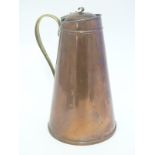 A W.A.S. Benson Arts and Crafts copper hot water jug with a brass handle and a hinged wooden lid.