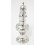 A 19thC large pepperette / small sugar caster hallmarked London 1818 5 1/2'' high Please Note - we