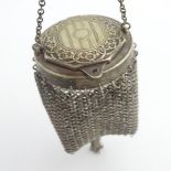 A white metal chatelaine purse with engraved hinge lid and chain mesh body. The whole approx. 5 1/2"