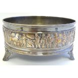 as silver plate three foot stand with frieze decoration depicting Romanesque figure. Approx 7"