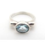 A late 20thC silver ring set with oval topaz. maker Kit Heath. The ring approx size K Please
