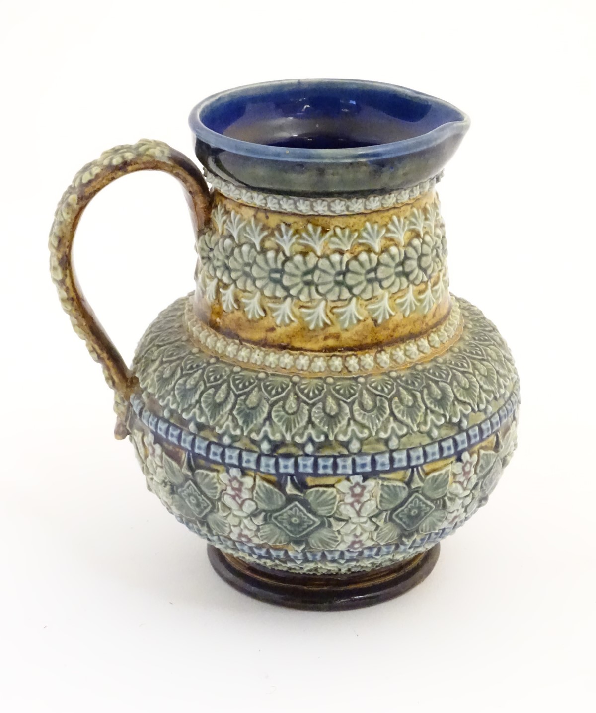 A 19thC Doulton Lambeth jug with a banded floral design in relief by Clara Baker. Doulton Lambeth