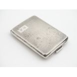 An Art Deco silver match book vesta case with engine turned decoration. Hallmarked Birmingham 1932