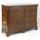 A large 19thC mahogany mule chest with a lid above two sham drawers and six short drawers with brass