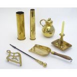 A quantity of assorted brassware, to include a chamber stick, lamp, trivet, First & Second World War