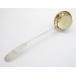 A German .800 silver ladle with gilded bowl and fiddle pattern handle. Maker Rosenthal. 12" long