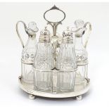 A Geo III silver cruet stand hallmarked London 1806 with 5 cut glass cruet bottle. The whole approx.