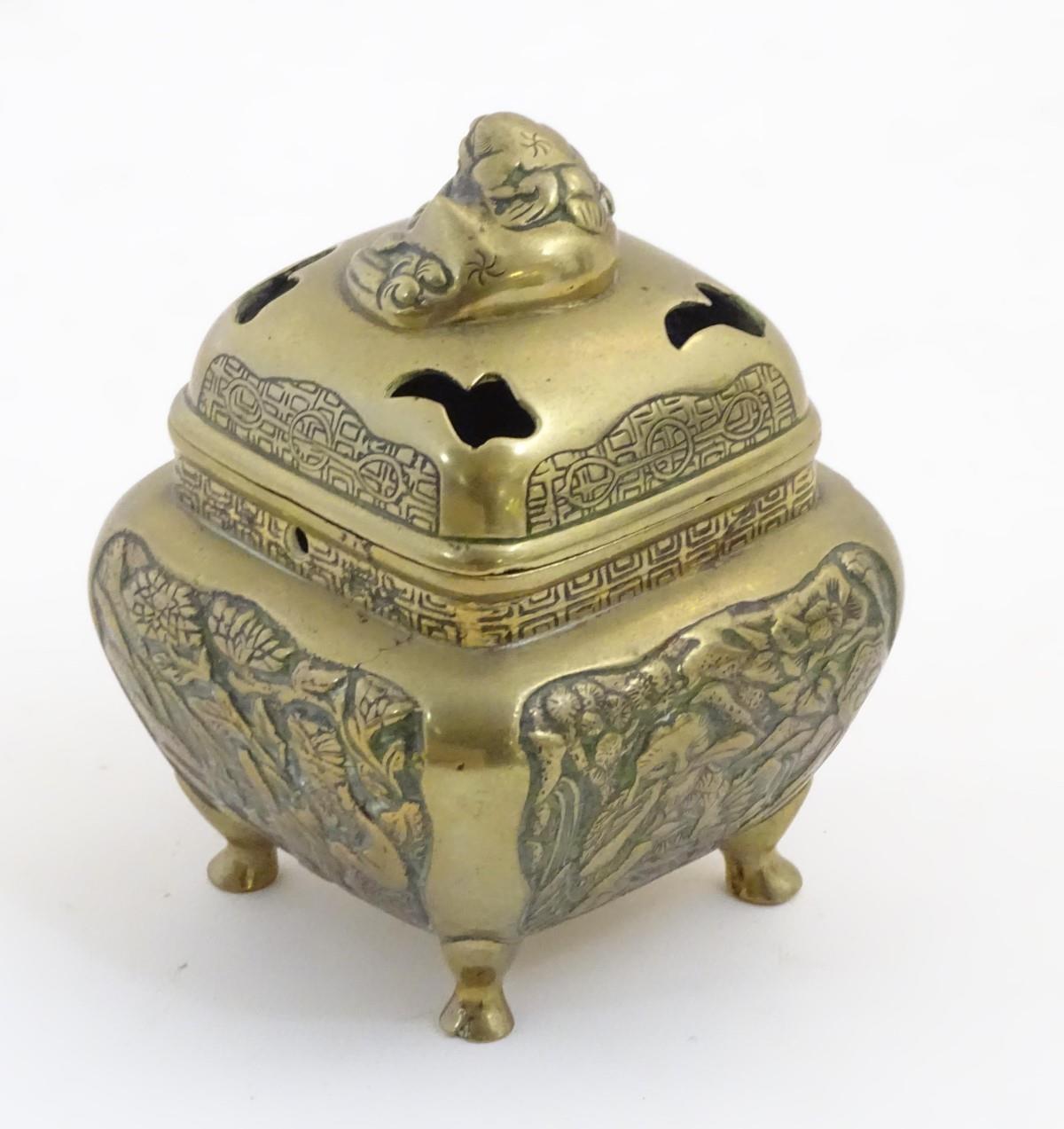 A Chinese lidded cast brass censor of squat form with panelled foliate decoration to sides, raised - Image 4 of 6