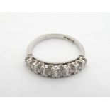 An 18ct white gold ring set with 8 graduated brilliant cut diamonds to top. Ring size approx N 1/