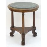 A mid 19thC mahogany Empire style centre table, having a circular marble inset to the centre above