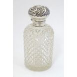 A hobnail cut glass scent / perfume bottle with silver mount and lid. Hallmarked Birmingham 1902