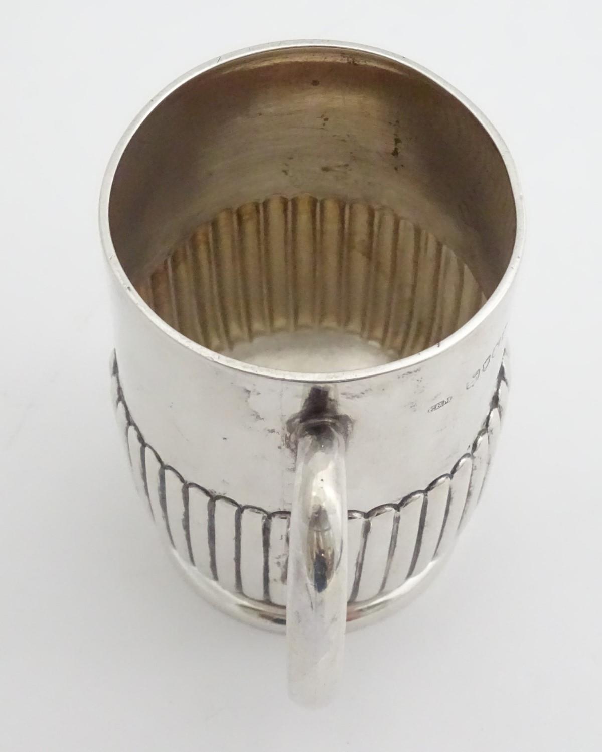 A silver Christening mug with loop handle. hallmarked London 1888 maker Army & Navy Cooperative - Image 2 of 6