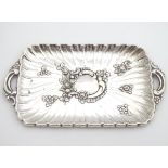 A late 19thC Spanish silver dressing table tray with embossed decoration. 6 1/4" wide (64g) Please